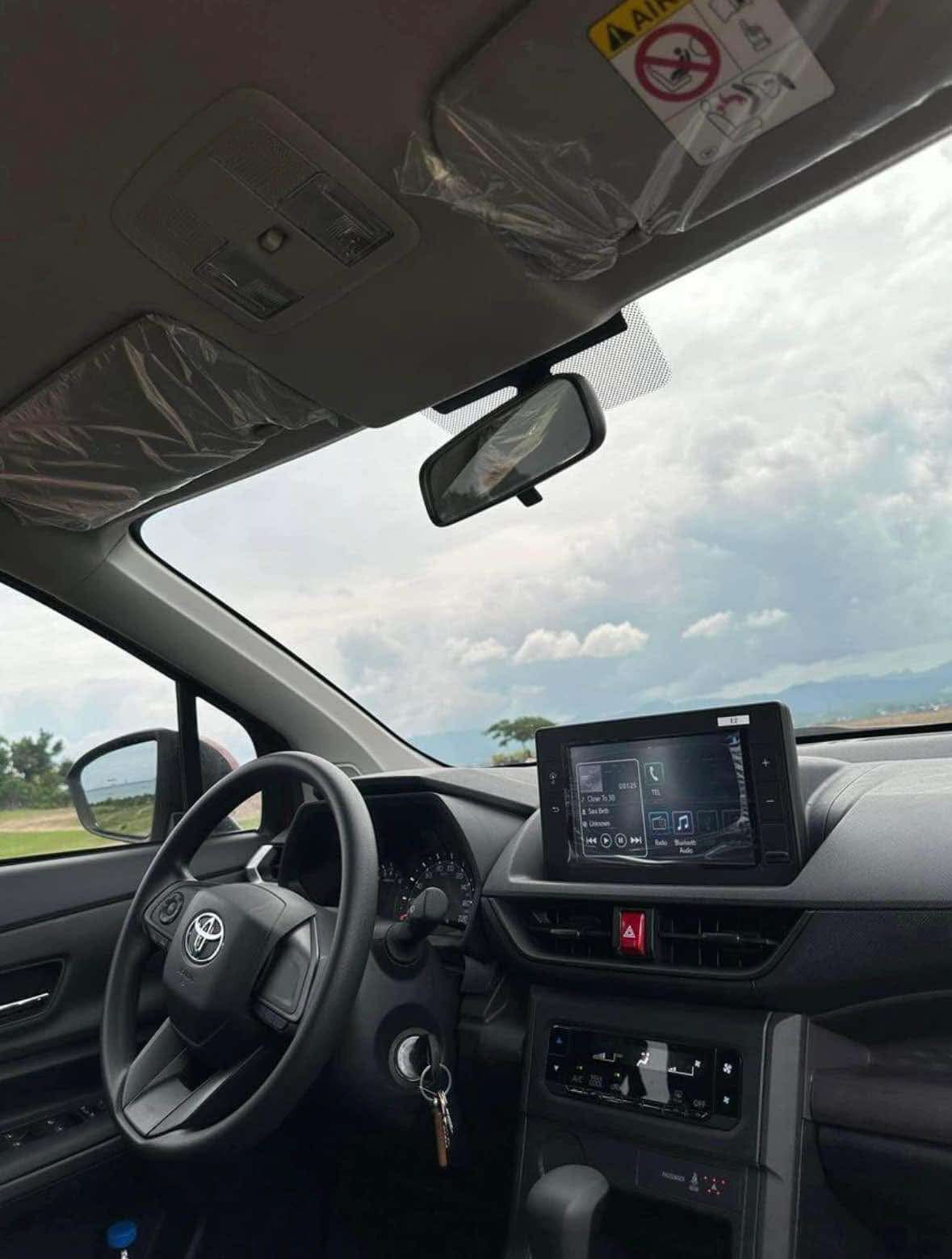 Driver's seat, steering wheel and touchscreen of a 2025 Toyota automatic